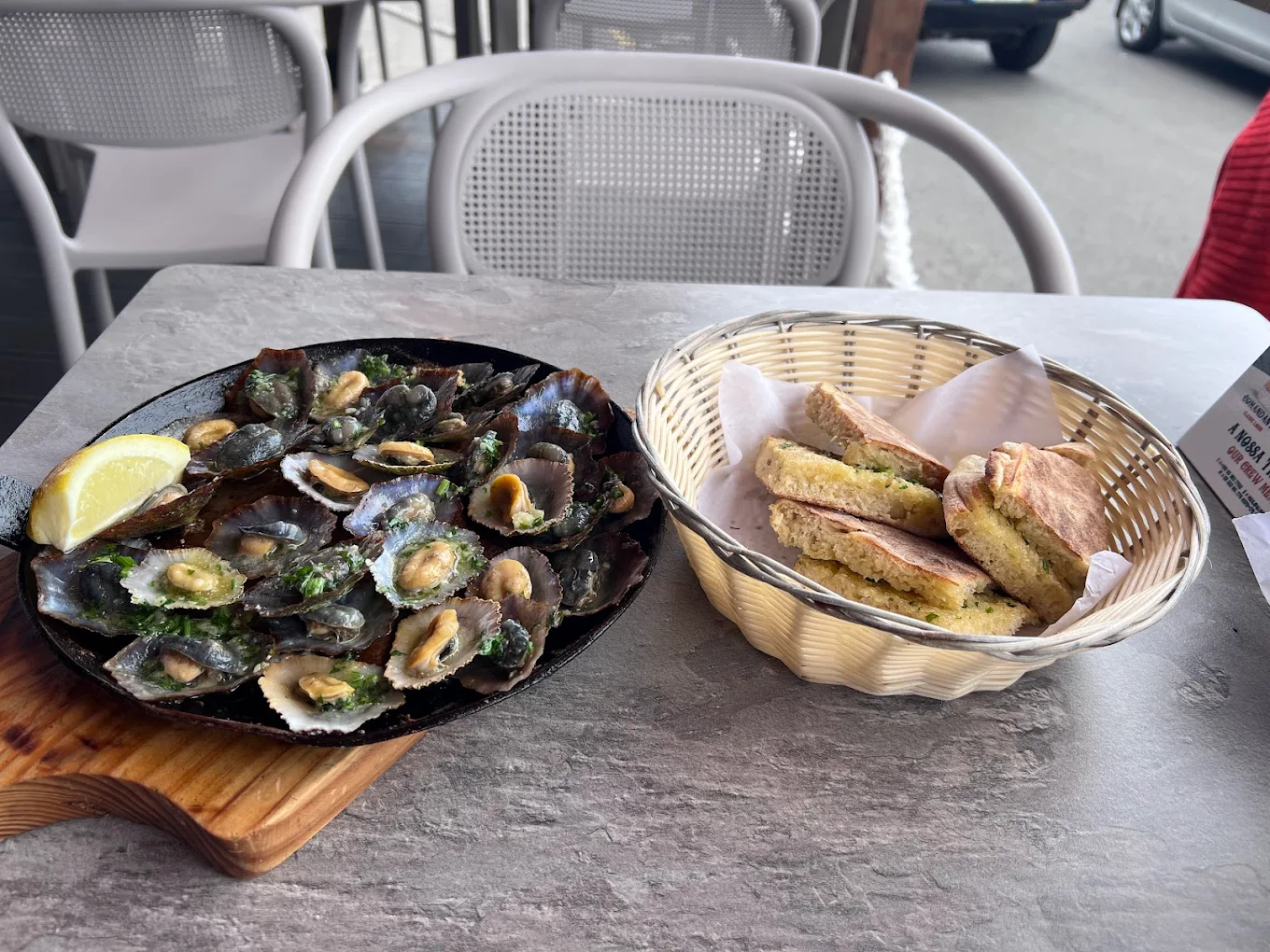 Dish of Lapas with Bolo do Caco bread aside